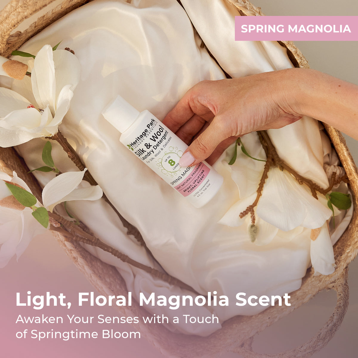 Spring Magnolia Heritage Park Silk and Wool Laundry Detergent 4oz bottle on a laundry basket