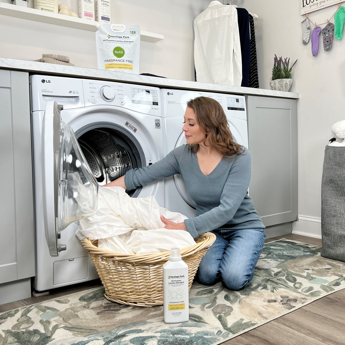 Women removing sheets from a dryer
