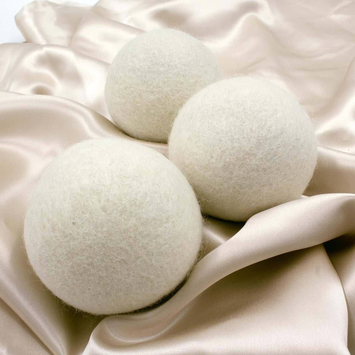 Close up shot of three Heritage Park Wool Dryer Balls