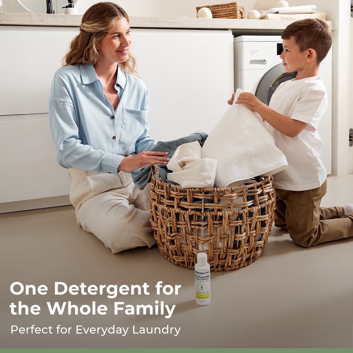 Mom and son doing laundry with Fragrance Free Heritage Park All Purpose 4oz bottle in front and a text saying it’s for the whole family