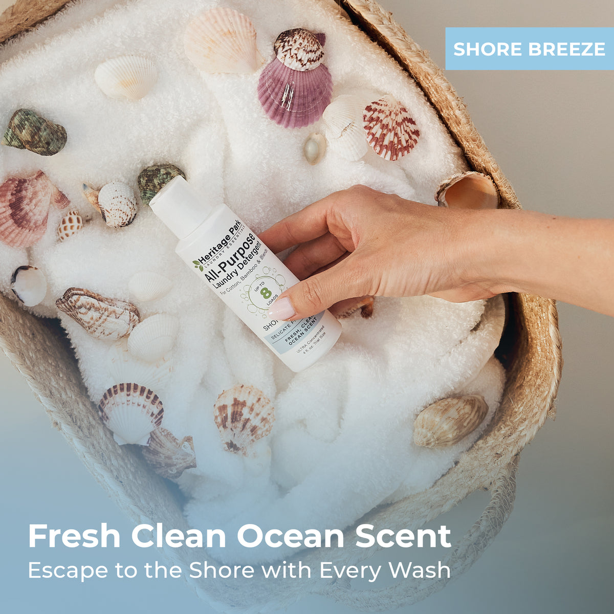 4oz bottle of Heritage Park All Purpose Laundry Detergent with shore breeze Fragrance on a laundry basket