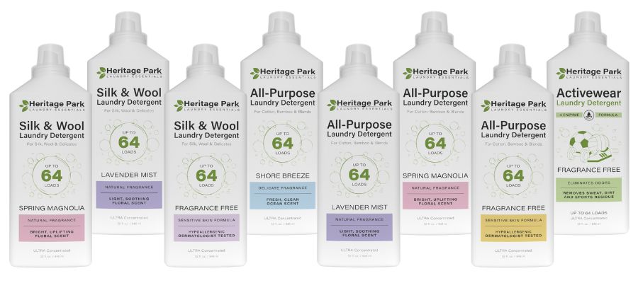 Lineup of Heritage Park Laundry Essentials detergents, including Silk & Wool, All-Purpose, and Activewear varieties, showcasing fragrances like Spring Magnolia, Lavender Mist, Shore Breeze, and fragrance-free sensitive formulas.